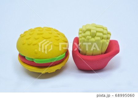 Selected focused of burger and french fries made from colorful toy soft rubber isolated on white background.  68995060