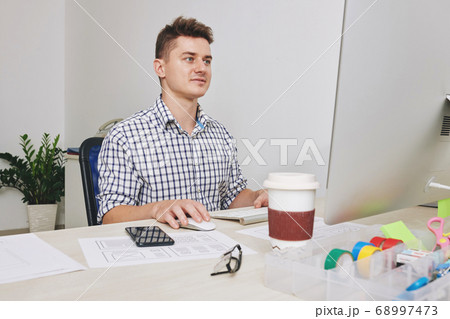 UI designer working on computer 68997473