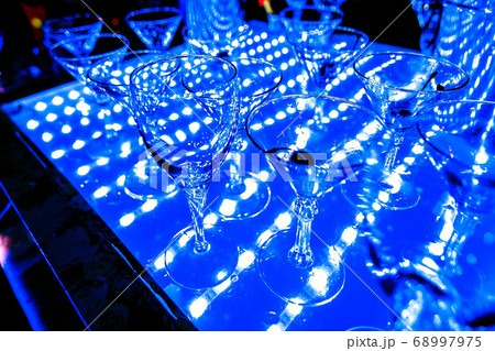 empty Martini and champagne glasses at a night party 68997975