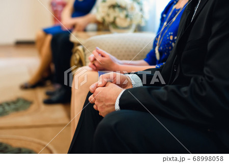 man in the suit squeezes his hands into fists. Symbolizes excitement, nerves man in the suit squeezes his hands into fists. Symbolizes excitement, nerves 68998058