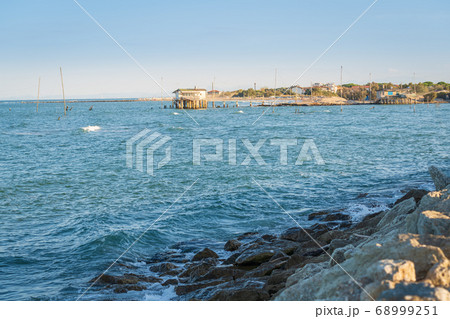 Fishing huts at sunny day 68999251