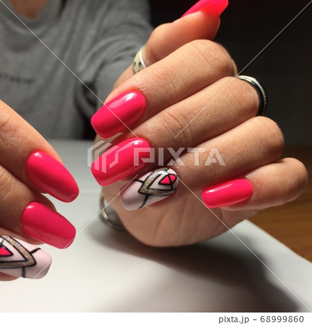 Female hands with stylish red manicure on grey Female hands with stylish red manicure on grey 68999860