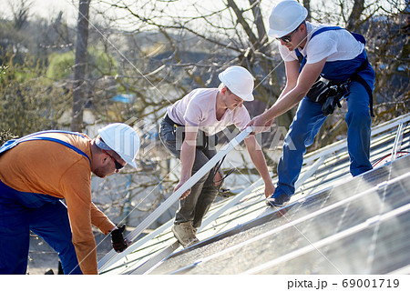Installing solar photovoltaic panel system on roof of house 69001719