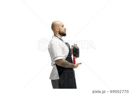 Portrait of a male chef cook, butcher isolated on a white studio background 69002770