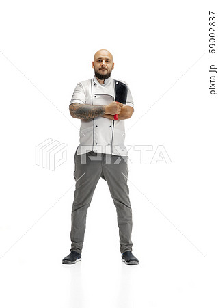 Portrait of a male chef cook, butcher isolated on a white studio background 69002837
