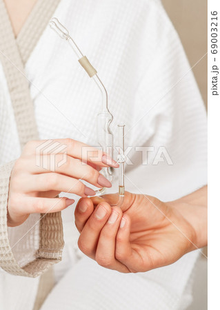 Nasal oil inhaler in hands. Nasal oil inhaler in hands. 69003216