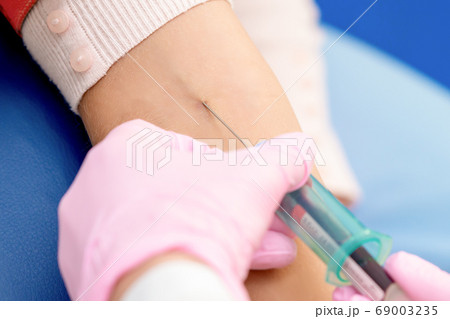 Nurse giving coronavirus vaccine. Nurse giving coronavirus vaccine. 69003235