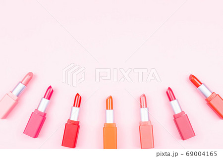 Set of pastel lipsticks on pink background with copy space,beauty and makeup concept Set of pastel lipsticks on pink background with copy space,beauty and makeup concept 69004165