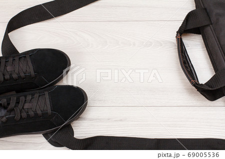 Women shoes and accessories on wooden desk 69005536