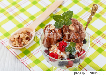 Chocolate and white ice cream in a glass with 69005560