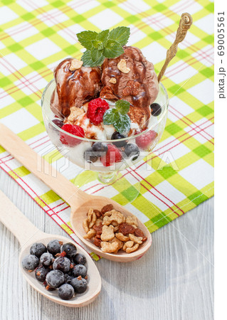 Chocolate and white ice cream in a glass with 69005561