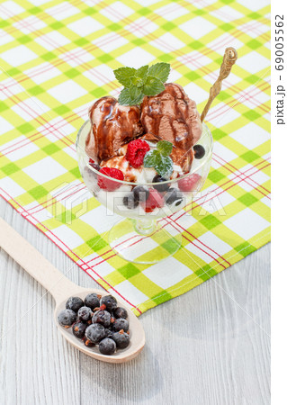 Chocolate and white ice cream in a glass with 69005562