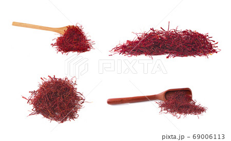 saffron threads and wooden spoon an isolated on saffron threads and wooden spoon an isolated on 69006113