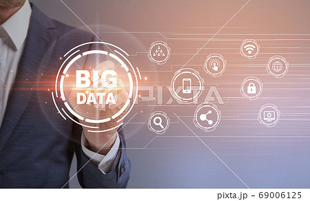 Big Data. Unrecognizable businessman pressing button on digital screen with virtual icons 69006125
