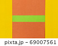 Green, Orange and Yellow coloured paper background 69007561