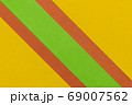 Green, Orange and Yellow coloured paper background 69007562