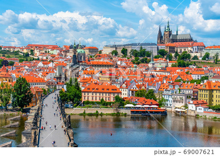 Prague panorama with Prague Castle, and Charles Bridge over Vltava River. View from Old Town Bridge Tower, Czech Republic Prague panorama with Prague Castle, and Charles Bridge over Vltava River. View from Old Town Bridge Tower, Czech Republic 69007621