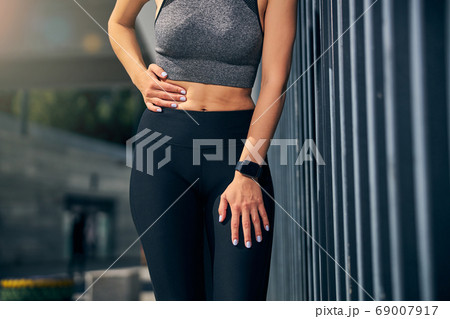 Close up of young woman suffering pain in side 69007917