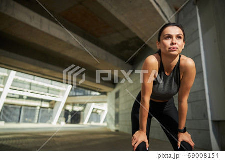 Close up of pretty woman being deep in thoughts 69008154