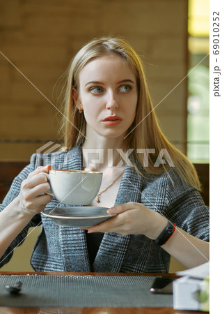 woman drinks tea woman drinks tea 69010252