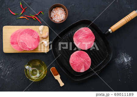 Top view of round tuna cutlet for burger or frying Top view of round tuna cutlet for burger or frying 69011189