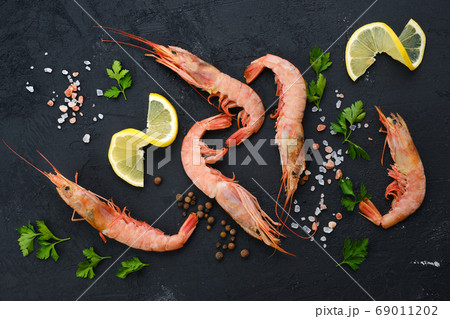 Top view of fresh raw prawn with spice and herbs 69011202