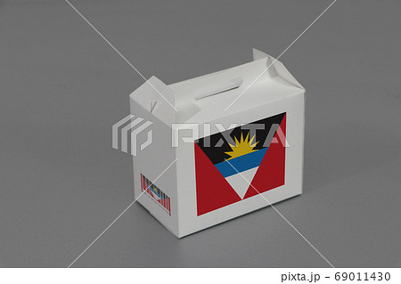 Antigua and Barbuda flag on white box with barcode and the color of nation flag.  69011430