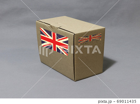 Union Jack flag on brown box with barcode, paper packaging for put products. Union Jack flag on brown box with barcode, paper packaging for put products. 69011435