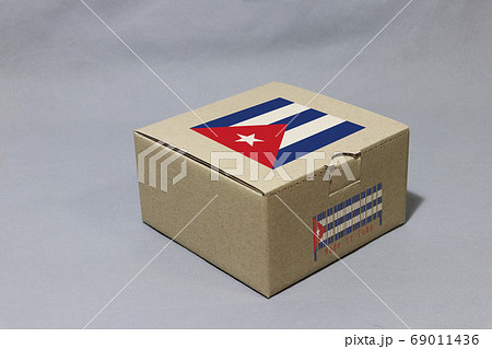 Cuba flag on brown box with barcode and the color of nation flag Cuba flag on brown box with barcode and the color of nation flag 69011436