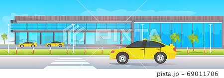 airport terminal outside yellow taxi cabs near modern flight departure 69011706