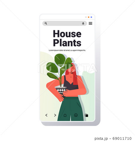 woman taking care of houseplants housewife holding potted plant smartphone screen portrait 69011710