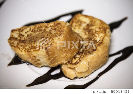 homemade french toast and presented on a white homemade french toast and presented on a white 69013431