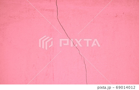 Pastel pink concrete wall surface, weathered with cracks and scratches, abstract texture for background Pastel pink concrete wall surface, weathered with cracks and scratches, abstract texture for background 69014012