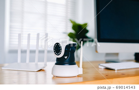 Security camera on Wood table. IP Camera. 69014543