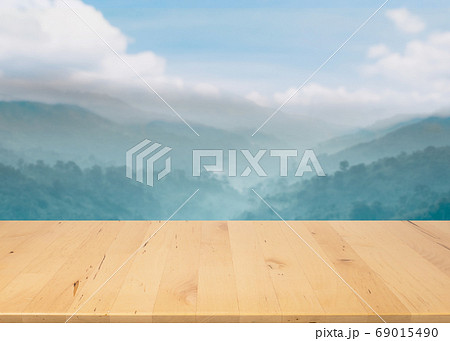 wood countertop with forest and mountain in spring 69015490