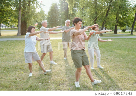 Doing qigong exercise Doing qigong exercise 69017242