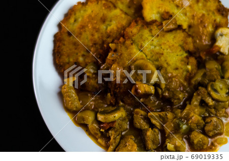 potato pancakes with spicy stew, delicious potato pancakes with spicy stew, delicious 69019335