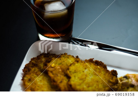 potato pancakes with spicy stew, delicious 69019358