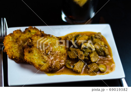 potato pancakes with spicy stew, delicious potato pancakes with spicy stew, delicious 69019382