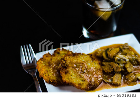 potato pancakes with spicy stew, delicious 69019383