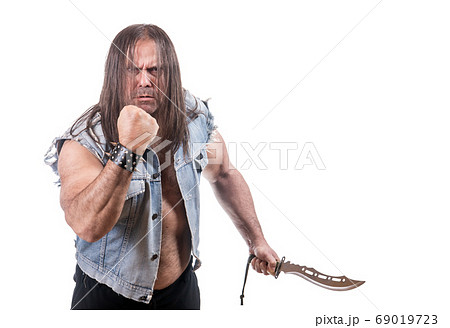 Aggressive man in jeans jacket threaten with fist Aggressive man in jeans jacket threaten with fist 69019723