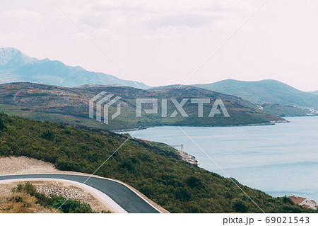 Black charred hills, after a forest fire, on the coast in Montenegro. Black charred hills, after a forest fire, on the coast in Montenegro. 69021543