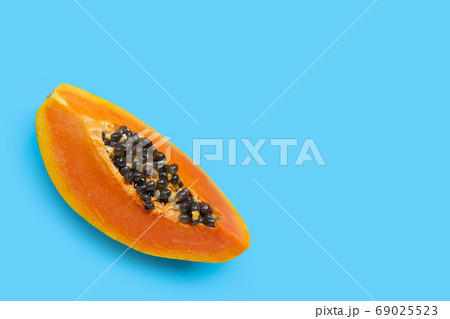 Papaya fruit on blue background. 69025523