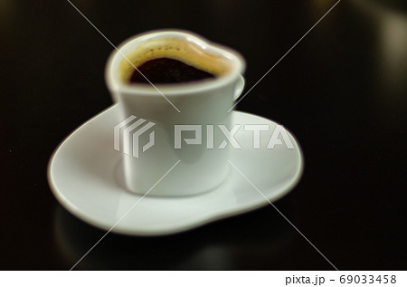 black coffee in a ceramic cup on the bar, energy black coffee in a ceramic cup on the bar, energy 69033458