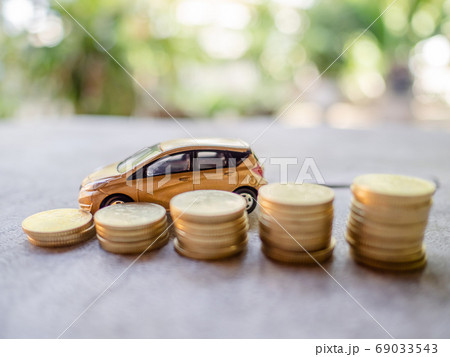 Golden cars with golden coins pile, business cars, Insurance, rent concept Golden cars with golden coins pile, business cars, Insurance, rent concept 69033543