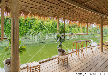 Wooden chairs in terrace restaurant in empty cafe. Interior desi 69035104