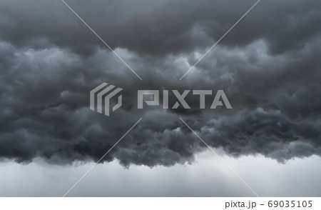 Dramatic dark grey clouds sky with thunder storm and rain. Abstr 69035105