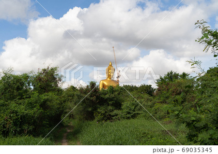 The Giant Golden Buddha in Wat Paknam Phasi Charoen Temple in Ph 69035345