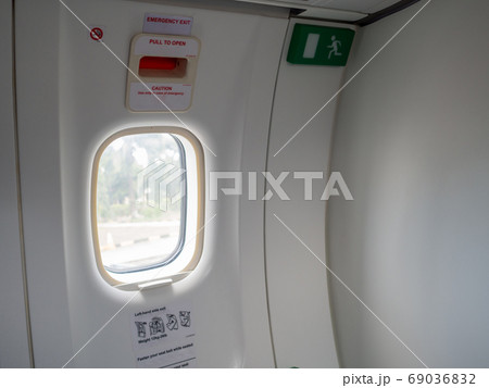 Emergency exit doors on the plane with the door opening method Emergency exit doors on the plane with the door opening method 69036832