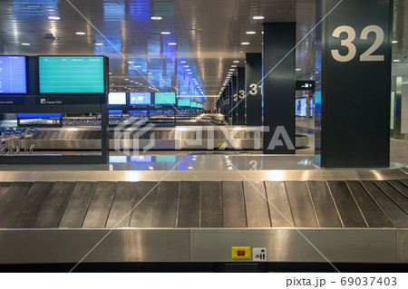 Empty rows of conveyor belts for luggage at the Empty rows of conveyor belts for luggage at the 69037403